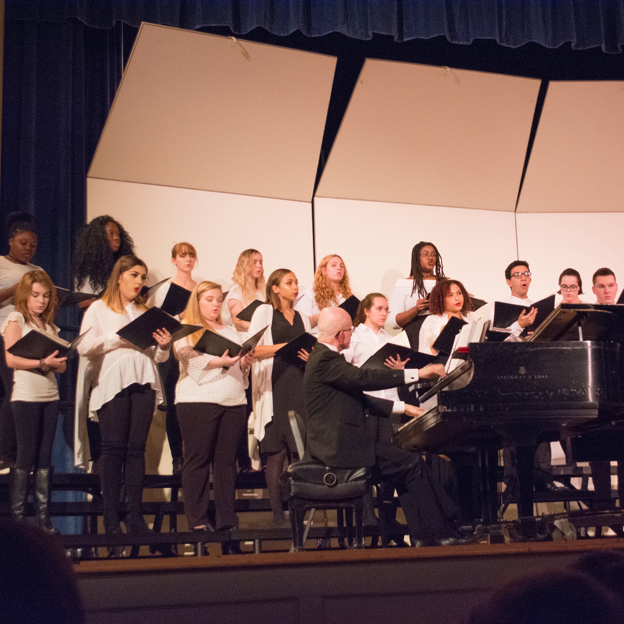 Students singing on stage